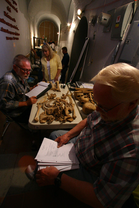 Dr Melbye, Dr Early, and Vicky Melbye Record Data on the Bones