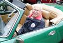 93-year-old ‘Spitfire’ Dick Frankish sits in one of his beloved Triumph Spitfire cars.