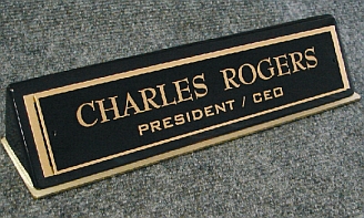 An office nameplate titled: Charles Rogers President: